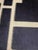 Dark navy and off white geometric pillow. Solid reverse side and zipper for inserting pillow, currently has new unused...