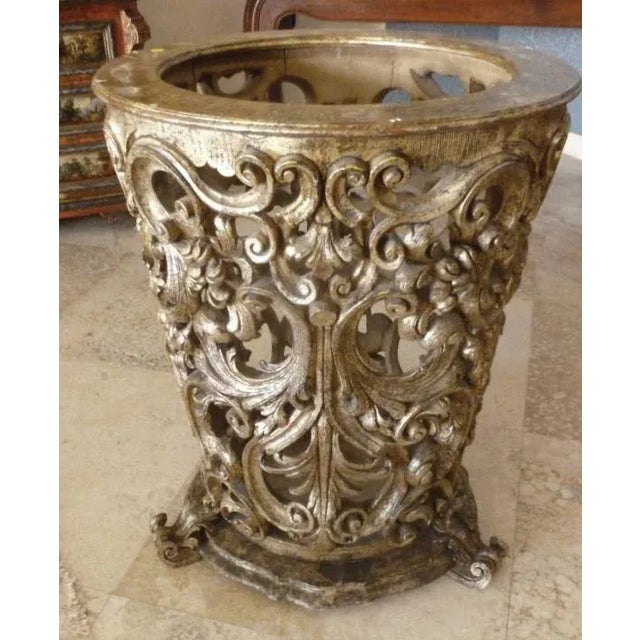 This is an intricately carved Venetian table base. The piece has silver gilt accents, but the glass base is not included.