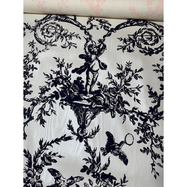 Wallpaper in black and white toile with moire background. There are 10 rolls. @900” per roll (25’)