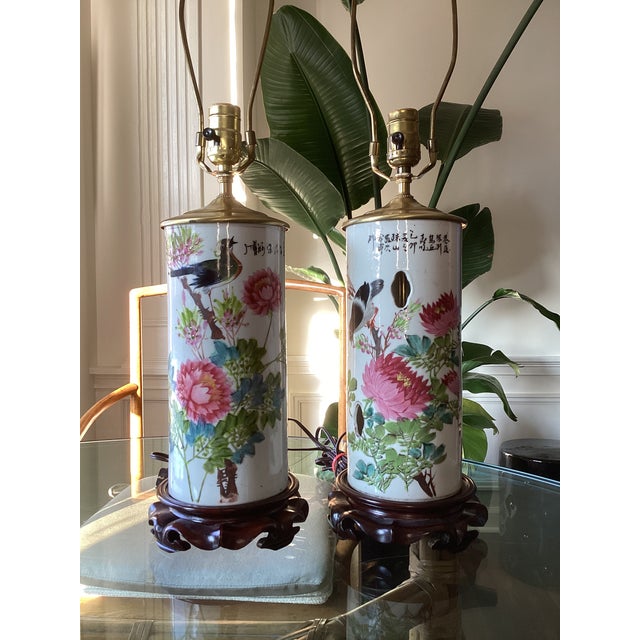 Charming pair of vintage Chinese porcelain table lamps featuring colorful hand-painted birds, peonies, chrysanthemums,...