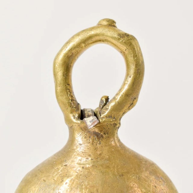 The brass metal bell was crafted by the Benue and Chamba artisans and metalworkers of Nigeria. These bells were often used...