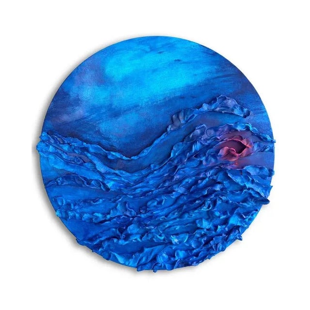 Mixed-media wall sculpture in modeling clay and acrylic on wood, a textural seascape in intense blue tones where layered...