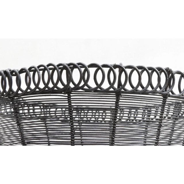 Charming handcrafted Provincial French woven wire work basket, circa 1900. A well-executed nicely shaped 'pannier' with...