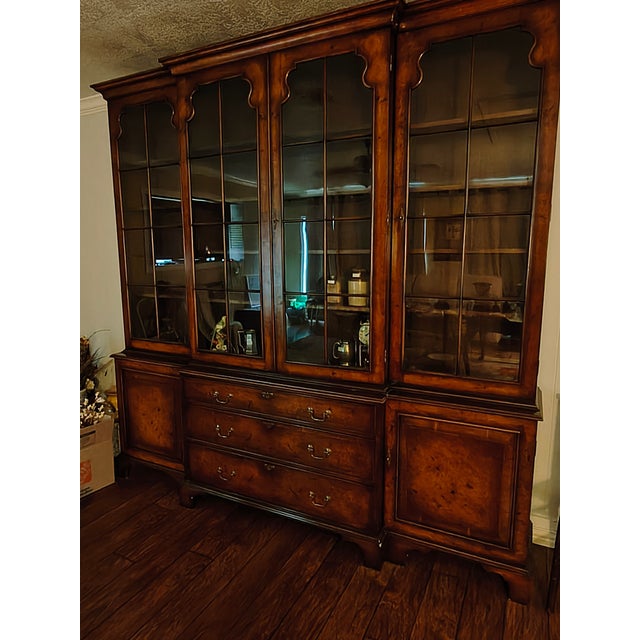 This is a Georgian Style Walnut Four Door Breakfront Bookcase/China Cabinet dating from the last half of the 19th century....