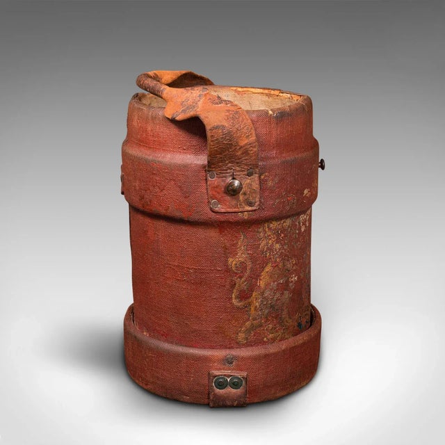This is an antique decorative bucket. An English, waxed canvas and leather log or storage bin, dating to the Edwardian...