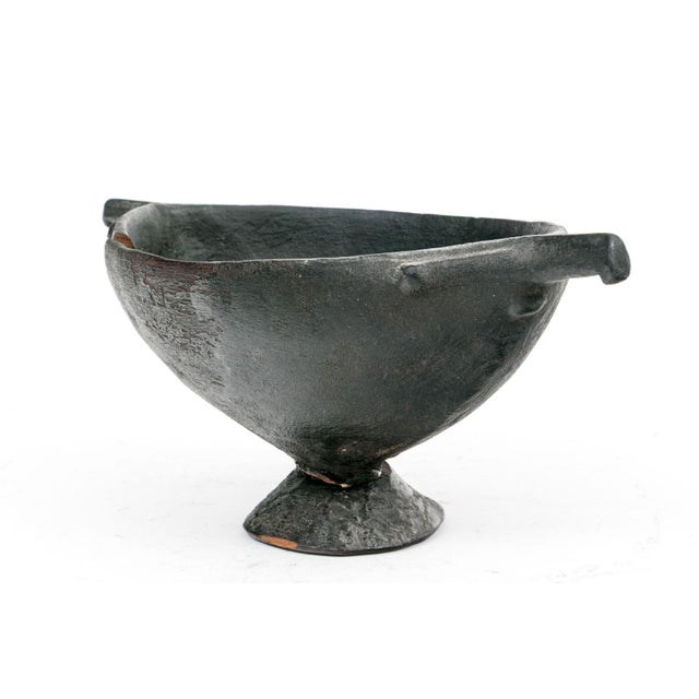 Antique African Oromo Carved Wood Vessel With Sculptural Handles This exceptional antique vessel is a masterful example of...