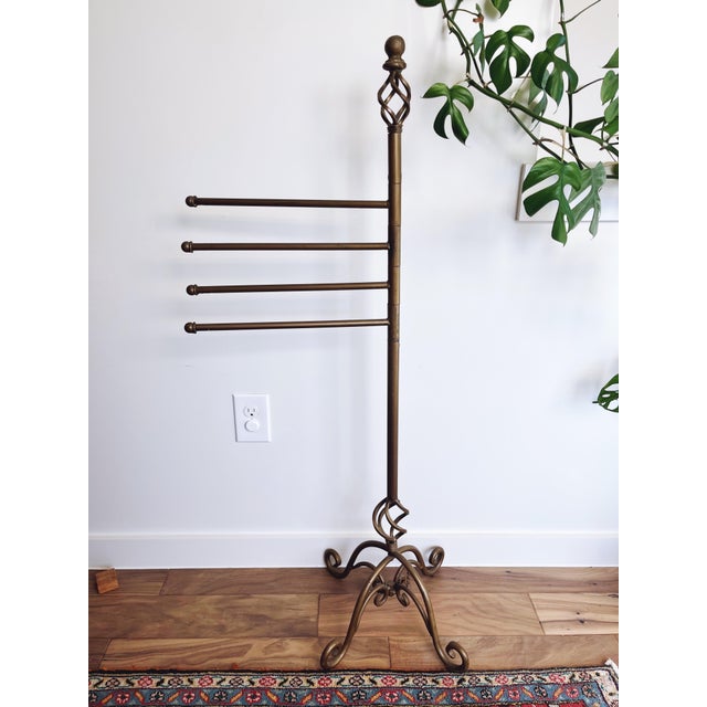 Vintage bronze painted iron towel rack. 45” height and each arm is 14” inches. Some chipped paint - see photos.