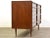 A mid century modern walnut six drawer dresser with wooden drawer pulls and dovetail joinery made by RWAY Furniture....