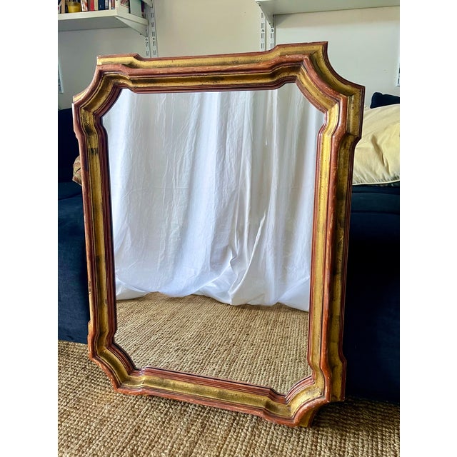 Beautiful antique italian baroque-inspired mirror, 19th century. Rectangular, scalloped shape with cut edges and chamfered...