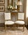 A sophisticated pair of mid-century Louis XVI–style giltwood side chairs, embodying timeless French elegance. Each chair...