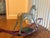 A charming antique hand-carved wooden rocking horse featuring a wonderfully weathered original painted finish and classic...
