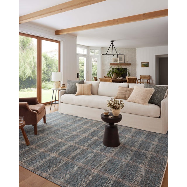The Ember Collection by Angela Rose x Loloi is a modern flatweave area rug with a timeless plaid pattern that adds depth...