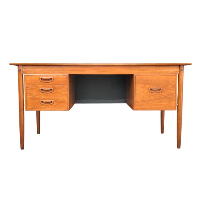 Elevate your workspace with this expertly restored Danish modern desk, a stunning example of mid-century craftsmanship and...