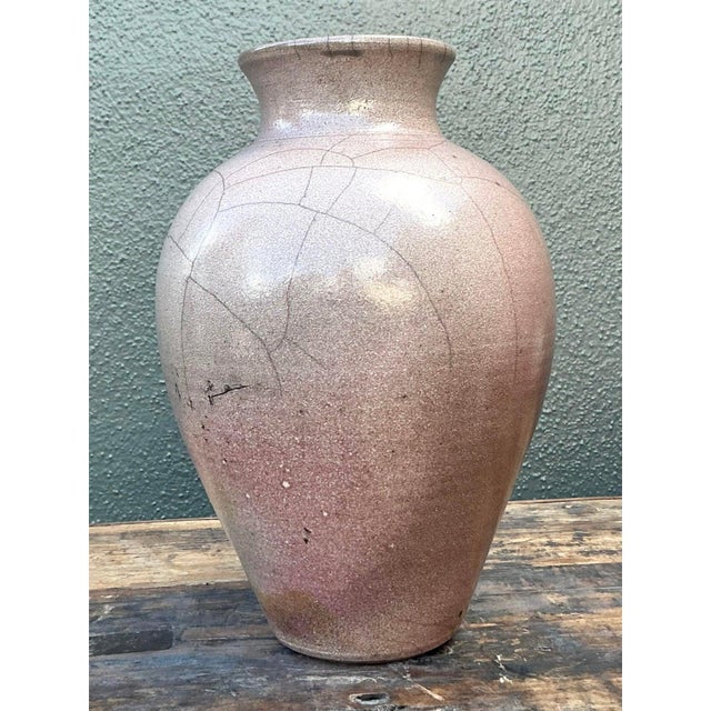 Introduce a soft, romantic hue to your stoneware collection with this lovely vintage studio pottery vase. Hand-thrown from...