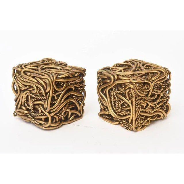 These amazing and fabulous pair of signed vintage French bronze square cube sculptures are meticulously intertwined works...
