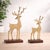 Elevate your seasonal décor with this stunning Gold Metal Deer Figurine Set. Featuring two graceful stag silhouettes...