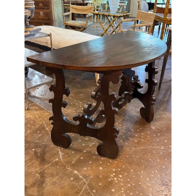 19th century Italian walnut Tuscan style demi-lune console. You're exploring a timeless classic—19th-century Italian...