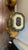 Rare matching pair of vintage ceramic elephant garden stools. The green elephants are decorated with colorful drapes in...