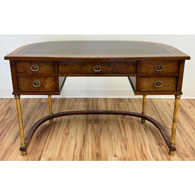 Vintage demilune burled walnut wood and brass desk by Sligh-Lowry. Features a sophisticated demilune shape with bowed...