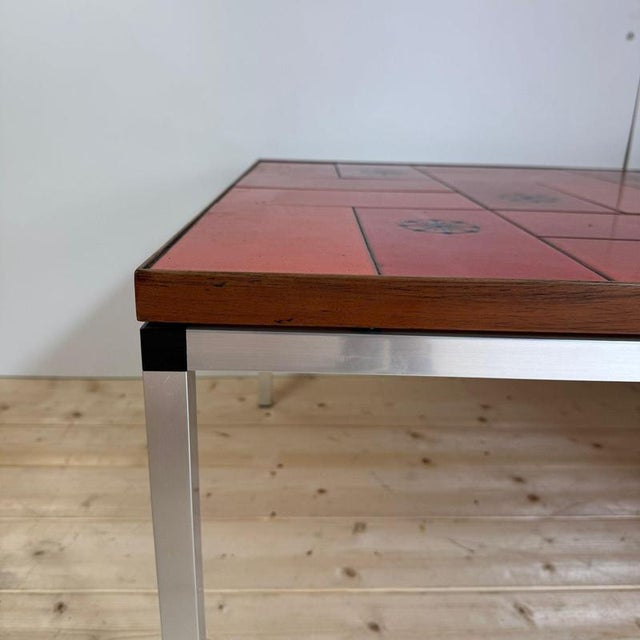 Mid-century optical coffee table in red ceramic, Denmark, 1960s H. 46 cm L. 130 cm D. 78,5 cm