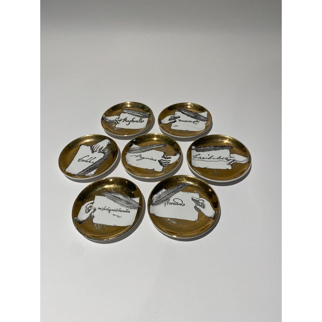 Set of Seven Vintage Italian Gilt Porcelain “Autografi” Coasters by Piero Fornasetti