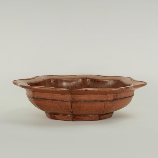 Impressive 19th century Chinese bowl handcrafted in elm wood in an octagon form with a scalloped edge and a traditional...