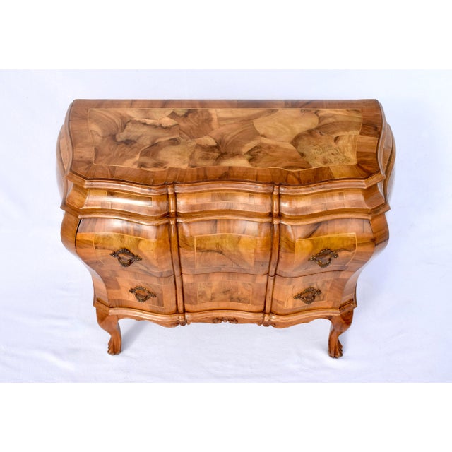 Oyster Burl Olive Commode Bombe Chest with banded top, striking wood grains, inlay details & two generously sized drawers....