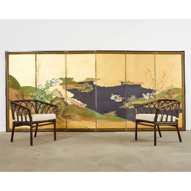 Stunning late 19th century Japanese Meiji period six panel byobu screen featuring a deep blue waterscape with pheasants...