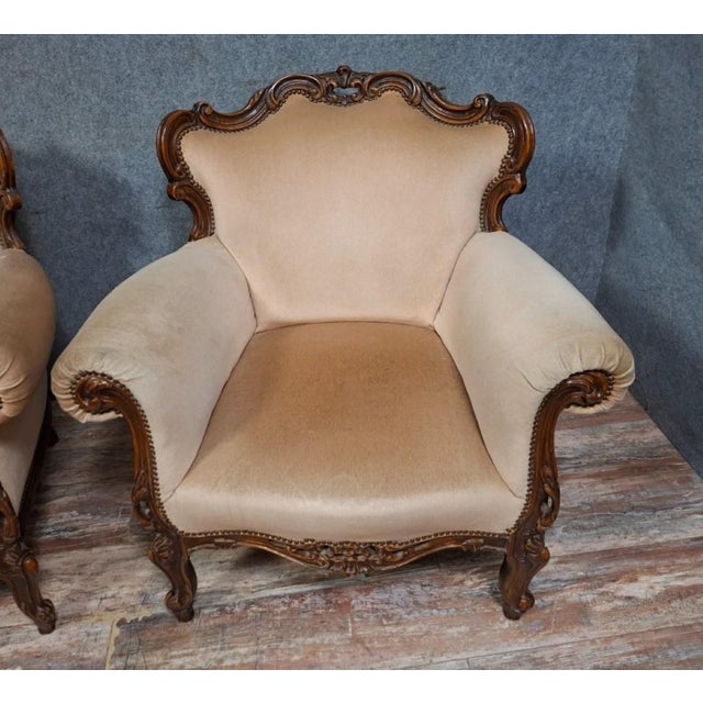 Pair of carved walnut armchairs – louis xv style – 20th century an elegant pair of carved walnut armchairs in the louis xv...