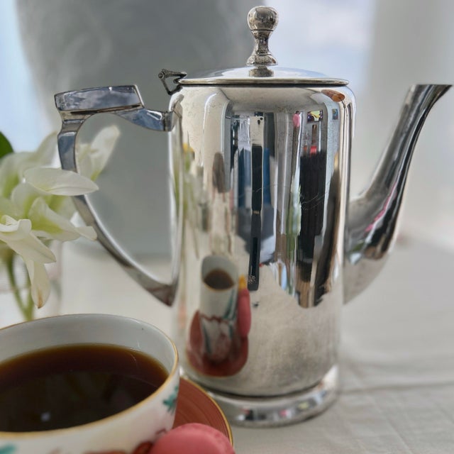 Bring timeless European café elegance and vintage charm to your tabletop with this handsome hotel silver coffee pot....