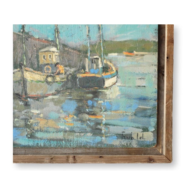 Midcentury oil painting of a tranquil French harbor, featuring two fishing boats docked along the shore. The artist...