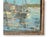 Midcentury oil painting of a tranquil French harbor, featuring two fishing boats docked along the shore. The artist...