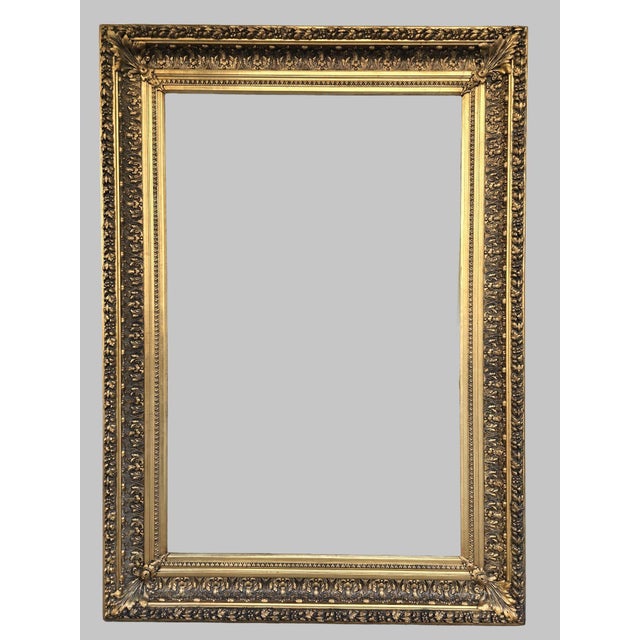 Original late 19th century French Napoleon III frame with richly detailed gilt composition ornamentation and aged patina....