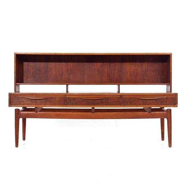 Kurt Ostervig Mid Century Danish Rosewood Low Credenza Bookcase This credenza bookcase measures: 65 wide x 22.25 deep x...