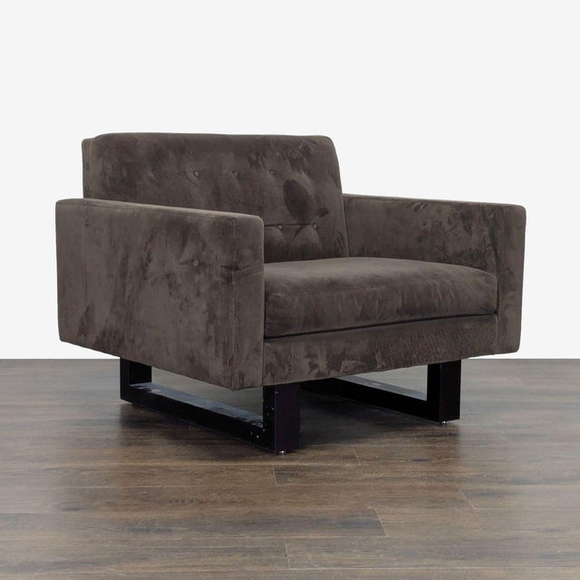 This Room & Board lounge chair offers a modern look with its clean lines and wide square arms. Upholstered in a stylish...