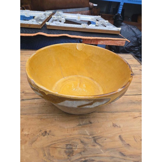A beautifully aged French terracotta confit bowl dating to the late 19th century. Once used for preserving foods such as...