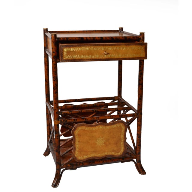Maitland-Smith British Colonial Style End Table or Stand with a faux tortoise finish over a turned wood faux bamboo frame....