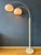 Dijkstra double arc floor lamp with white acrylic glass mushroom shades. The shades produce a warm light and can be turned...
