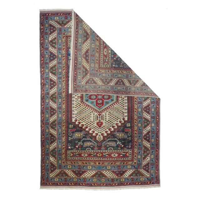 Look Turkish, but actually a masquerading vintage Caucasian with a red field with barbed sickle leaf corners around a...