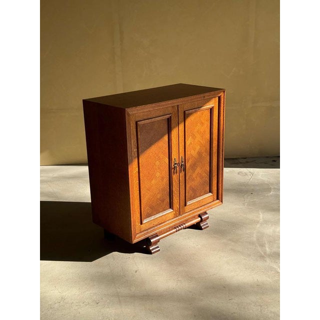 Cute small Art Deco cabinet in oak with lovely legs in absolute perfect refinished condition. 2 opening doors with lots of...