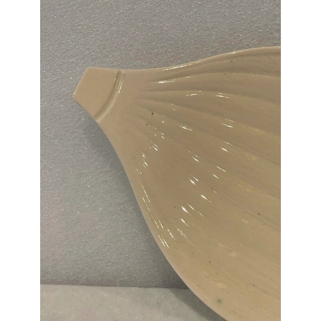 Mid century modern creamware plate in the form of an onion. 5 available at time of listing.