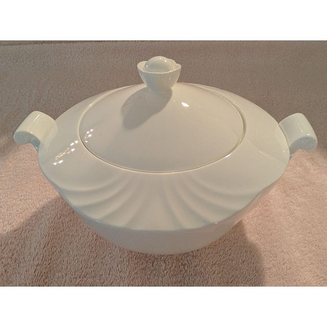 A like-new 1.5-quart covered vegetable dish by Villeroy & Boch in the "Arco Weiss" pattern of an embossed fan design, and...