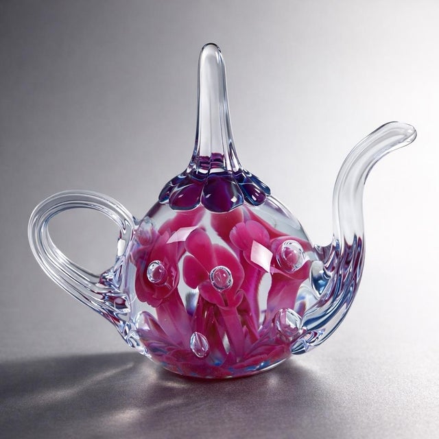 A rare, high-contrast St. Clair art glass teapot with vivid magenta florals suspended in crystal clarity. An exceptional...
