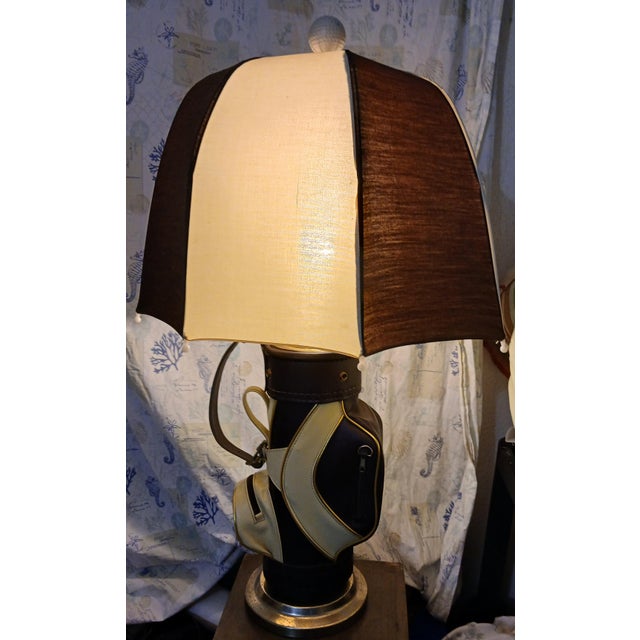 1980s golf bag table lamp with umbrella shade and golf ball finial. Perfect for the golfing Fanatic in your life, makes a...