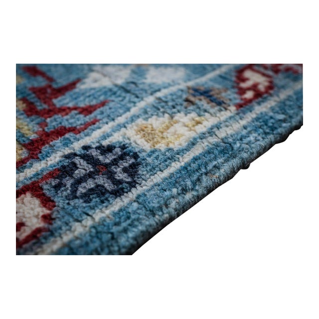 A hand-knotted wool Oushak, made in India and measuring 8' x 10'. Oushak weaving is known for large-scale, softly drawn...