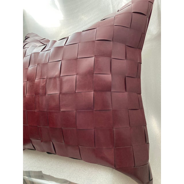 This 26" Euro square pillow cover features a stylish basketweave pattern in maroon faux leather (with a cotton canvas...