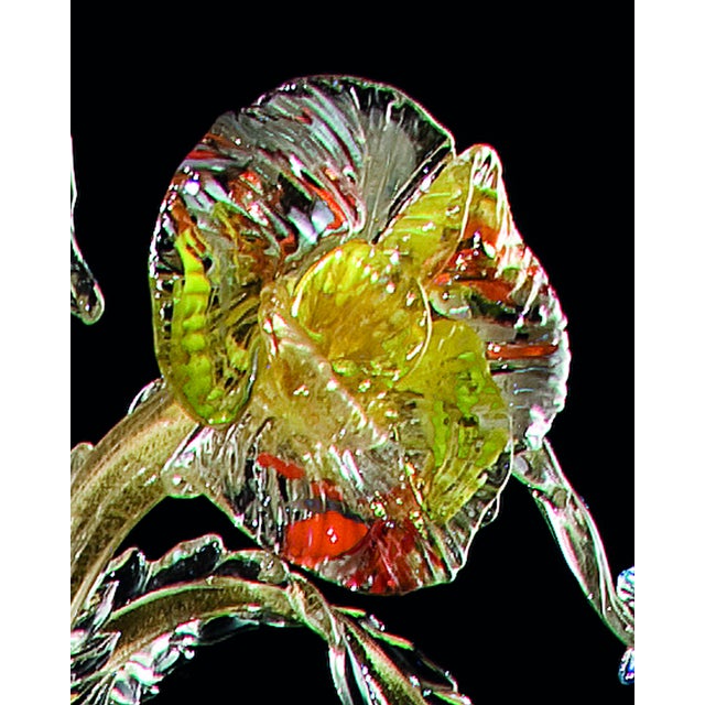 Venetian luxury and scenographic chandelier with multicoored flowers and leaves pinched by one to one.Every piece is...