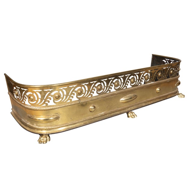 Decorated with pierced Vitruvian design and paw feet.