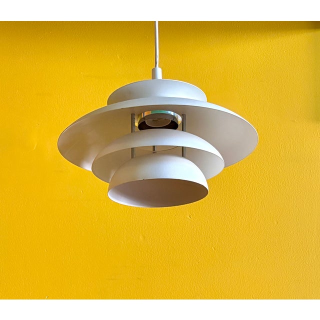 A classic vintage Danish white multiple layer small pendant lamp.