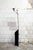 Adjustable floor lamp with chromed metal stem and cast iron base. MP model Designer Ennio Chiggio Manufacturer Lumenform...
